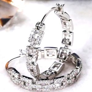 WHITE 14K/STERLING CHAIN STYLE HOOP EARRINGS WITH WHITE TOPAZ STONES. 1in